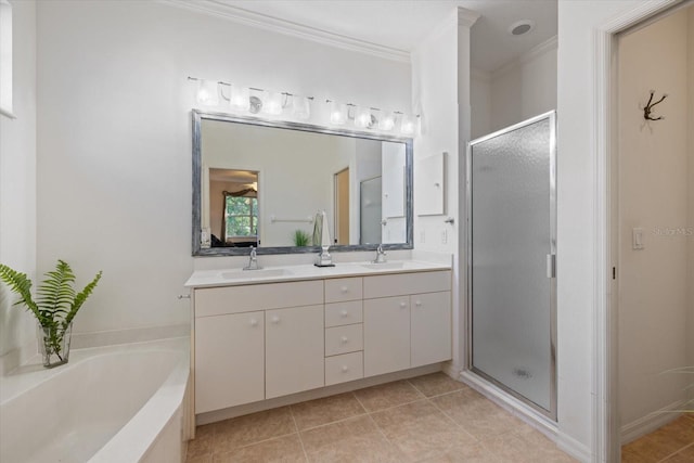 full bath with tile patterned flooring, double vanity, a stall shower, and a sink