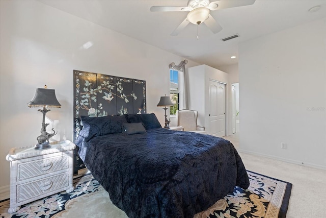 bedroom featuring visible vents, baseboards, carpet, and ceiling fan