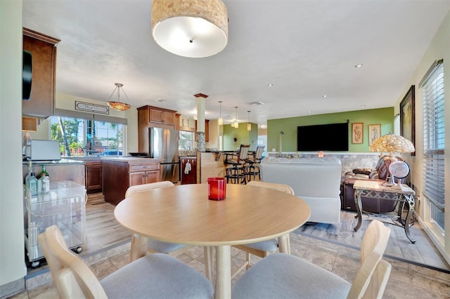 dining space featuring recessed lighting