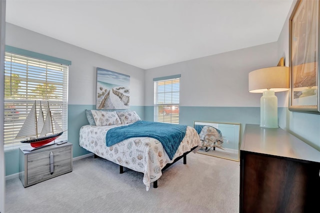 carpeted bedroom featuring baseboards