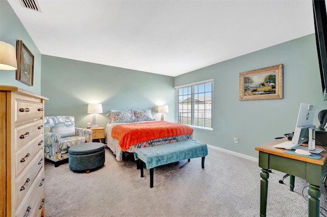 bedroom featuring visible vents, baseboards, and carpet