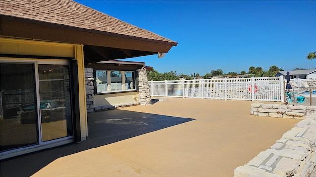 view of patio / terrace featuring fence