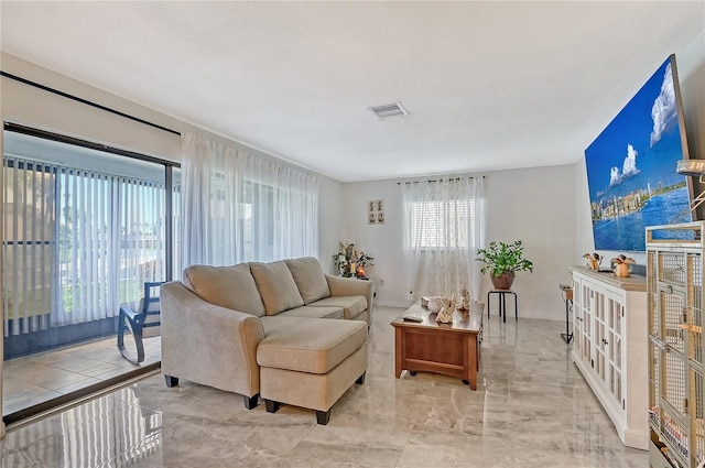 living room featuring visible vents