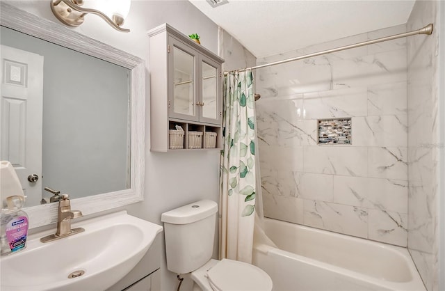 bathroom with shower / bath combo with shower curtain, toilet, and vanity