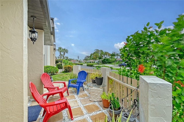 view of patio / terrace featuring fence