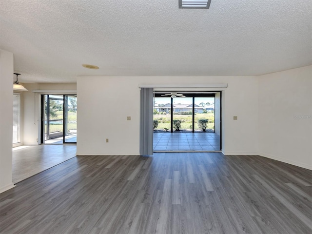 1602 Jim Jim Ct, Venice, FL 34293 - spare room with a textured ceiling and wood finished floors