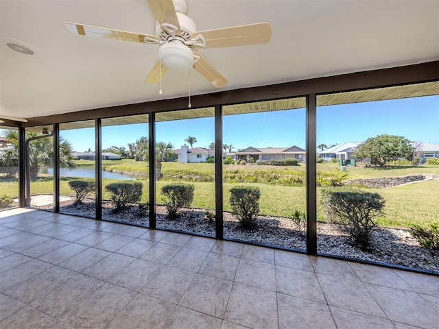 1602 Jim Jim Ct, Venice, FL 34293 - unfurnished sunroom with tile patterned flooring, a water view, and plenty of natural light