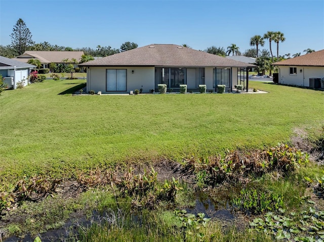 1602 Jim Jim Ct, Venice, FL 34293 - rear view of house featuring a lawn and a shingled roof