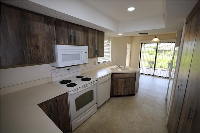 1602 Jim Jim Ct, Venice, FL 34293 - kitchen featuring white appliances, plenty of natural light, a peninsula, light countertops, and recessed lighting