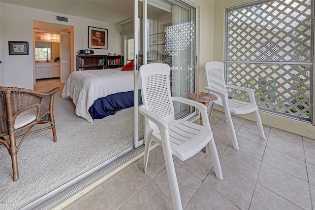 bedroom with visible vents and light tile patterned flooring