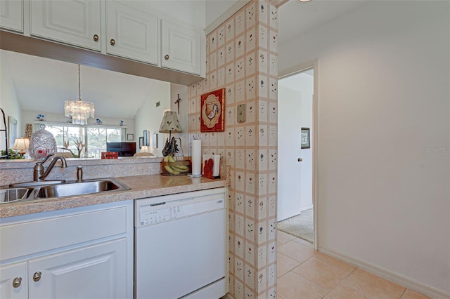 kitchen featuring a sink, white cabinets, white dishwasher, light countertops, and light tile patterned floors