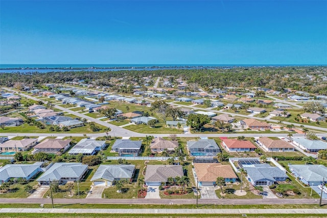 birds eye view of property with a residential view