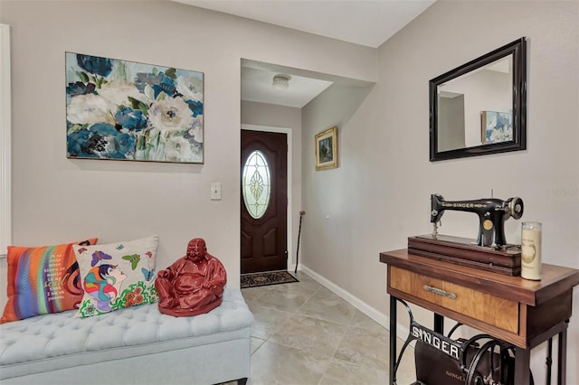 entryway featuring light tile patterned floors and baseboards