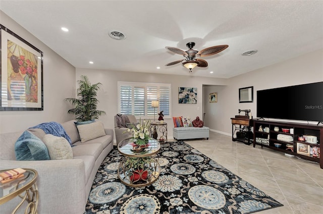 living area with light tile patterned floors, visible vents, recessed lighting, and a ceiling fan