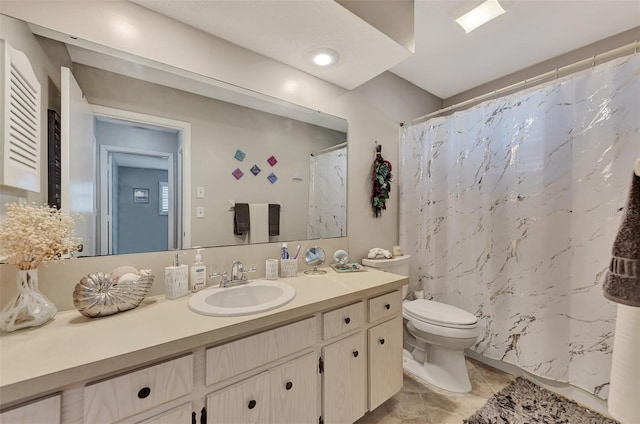 bathroom with toilet, vanity, and a shower with curtain