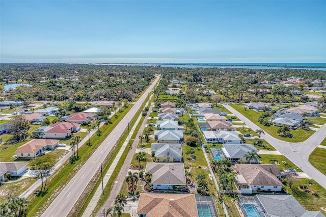 aerial view featuring a residential view and a water view