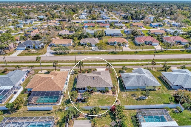 birds eye view of property with a residential view