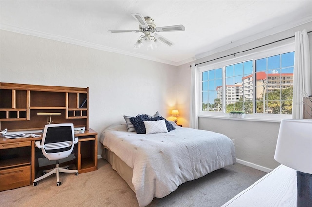 bedroom with ceiling fan, baseboards, light carpet, and ornamental molding