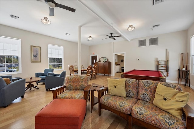 living room featuring light wood-style flooring and visible vents