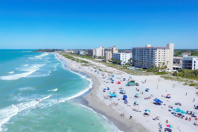 aerial view with a water view, a view of city, and a view of the beach