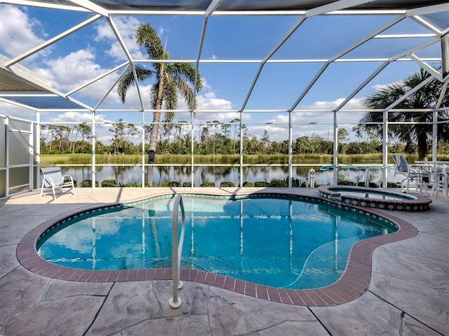 view of pool with glass enclosure, a water view, and a patio area