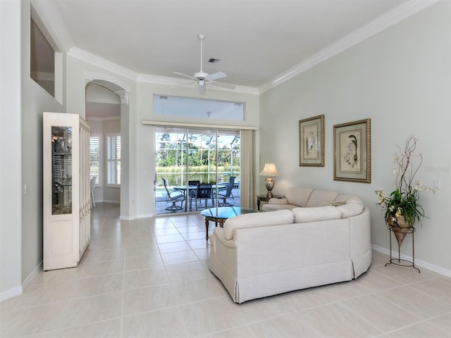 living room featuring light tile patterned flooring, a healthy amount of sunlight, crown molding, and ceiling fan