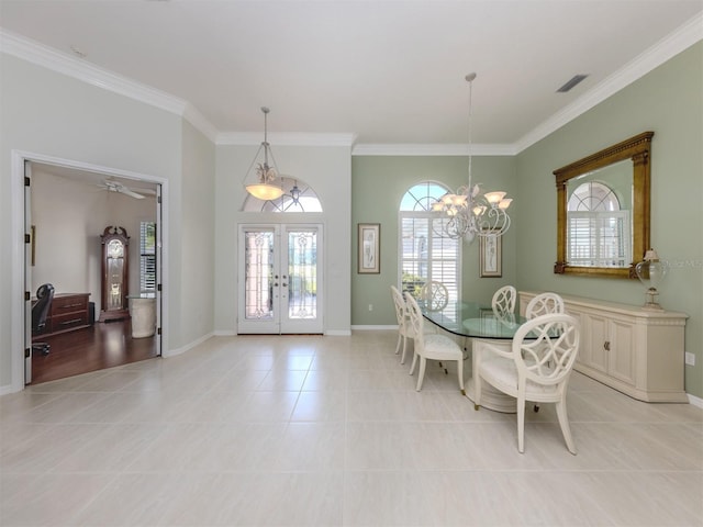 dining space with crown molding, baseboards, light tile patterned floors, french doors, and an inviting chandelier