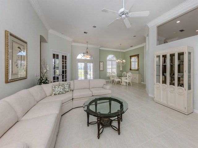 living area with light tile patterned floors, french doors, baseboards, and ornamental molding