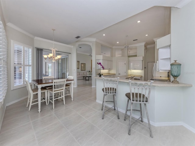 kitchen featuring visible vents, recessed lighting, a peninsula, crown molding, and light countertops