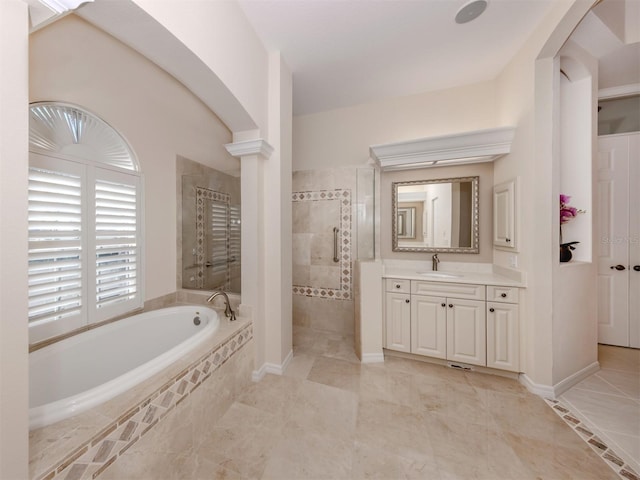 full bath with baseboards, a garden tub, vanity, and a walk in shower