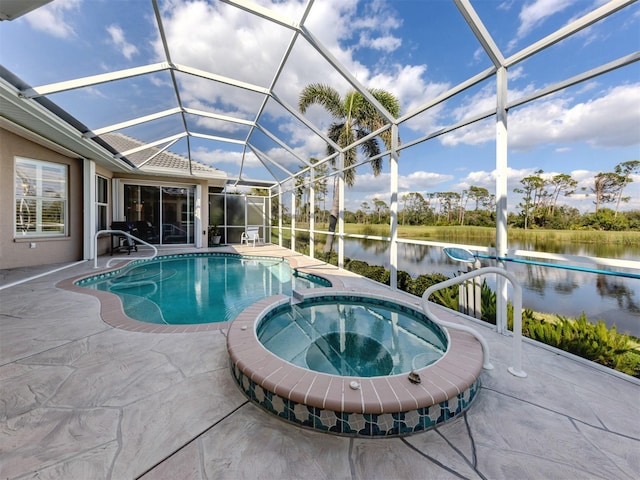 view of swimming pool with a patio, a water view, a pool with connected hot tub, and a lanai