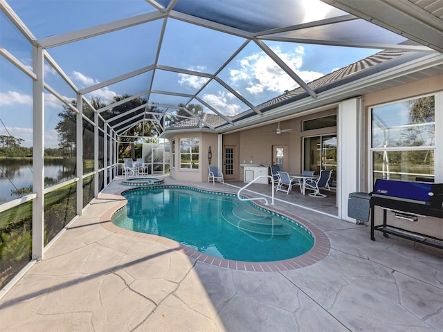 view of pool with a patio, a water view, a pool with connected hot tub, and a lanai