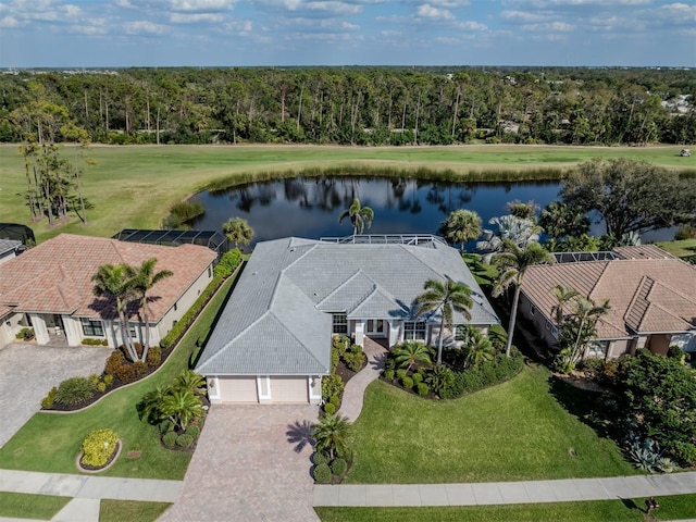 bird's eye view with a wooded view and a water view