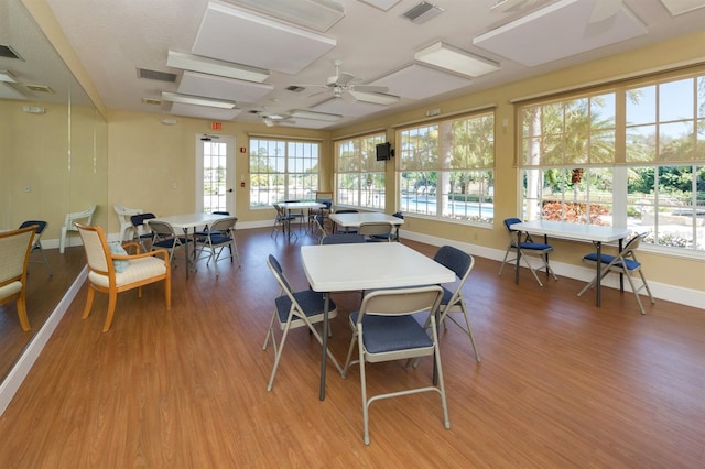 dining area with plenty of natural light, visible vents, and light wood-type flooring