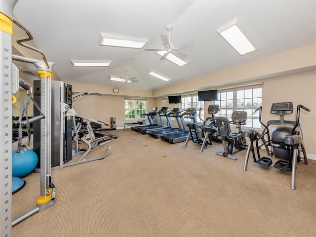 gym featuring carpet flooring, baseboards, lofted ceiling, and a ceiling fan