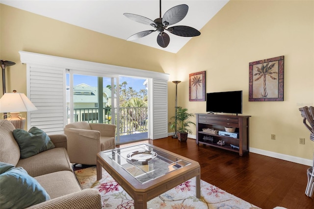 living room with baseboards, high vaulted ceiling, wood finished floors, and a ceiling fan