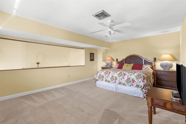 carpeted bedroom featuring visible vents, ceiling fan, and baseboards