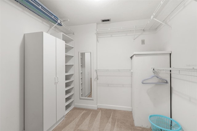 spacious closet featuring visible vents and carpet