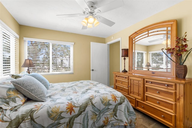 carpeted bedroom featuring ceiling fan