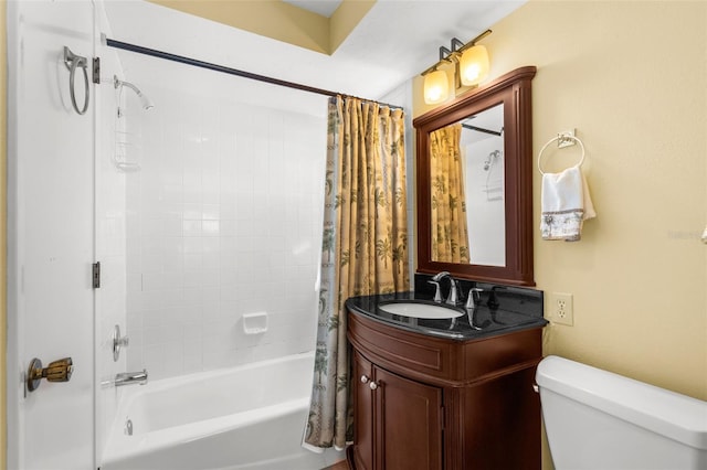 bathroom with vanity, shower / bath combination with curtain, and toilet