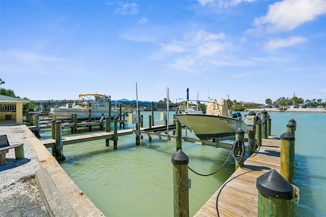 view of dock featuring a water view and boat lift