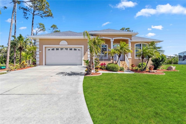 951 Sea Fox Rd, Venice, FL 34293 - view of front facade featuring stucco siding, a porch, concrete driveway, and a front yard
