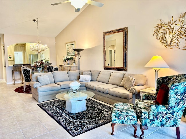 living area with arched walkways, high vaulted ceiling, light tile patterned flooring, and ceiling fan with notable chandelier