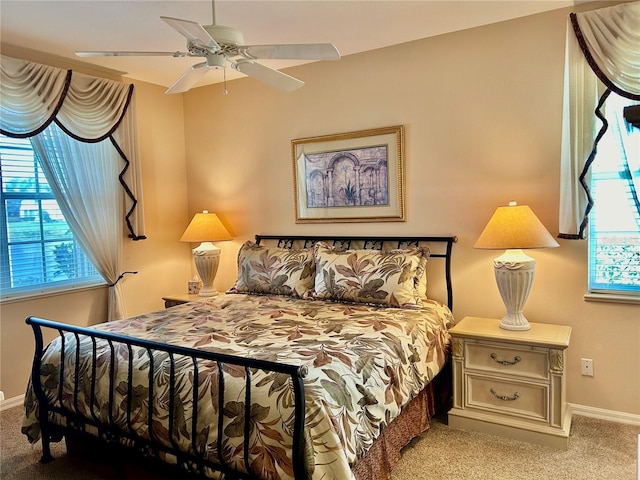 bedroom featuring baseboards, carpet, and a ceiling fan