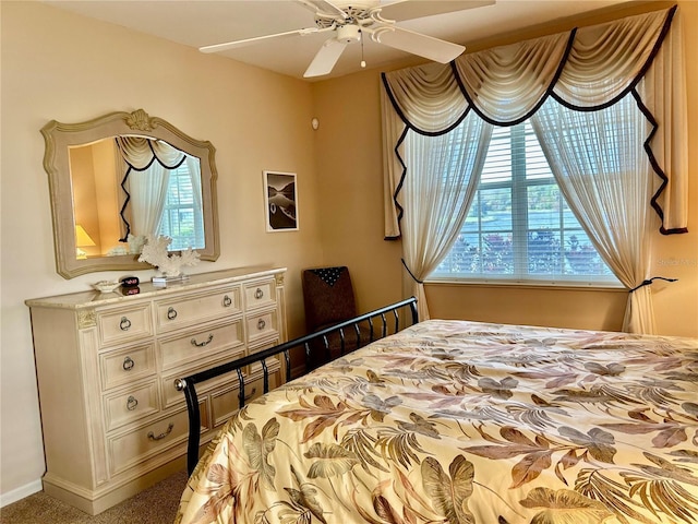 carpeted bedroom with multiple windows and baseboards