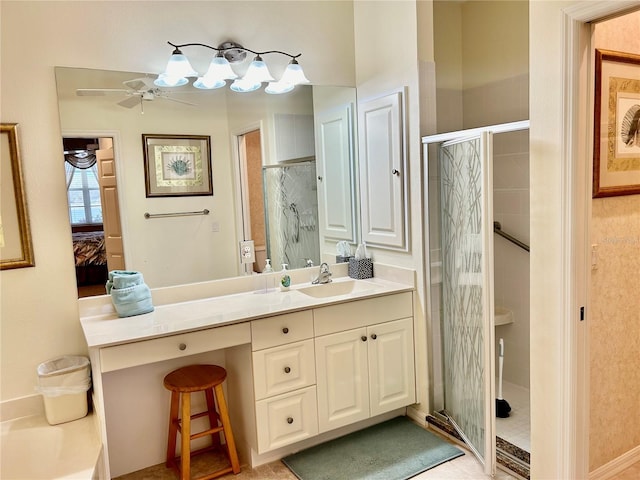 bathroom with a shower stall and vanity