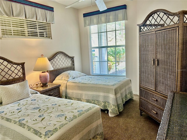 bedroom with ceiling fan and carpet flooring