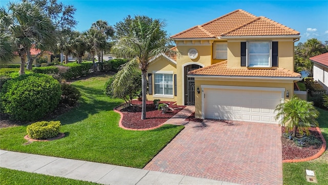 23901 Waverly Cir, Venice, FL 34293 - mediterranean / spanish-style house featuring decorative driveway, a tile roof, stucco siding, a front lawn, and a garage