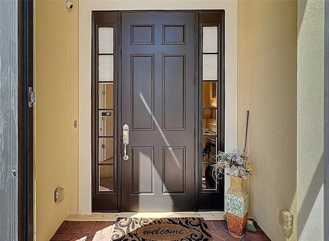 23901 Waverly Cir, Venice, FL 34293 - doorway to property featuring stucco siding