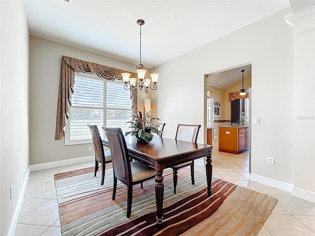 23901 Waverly Cir, Venice, FL 34293 - dining area with light tile patterned floors, a chandelier, and baseboards